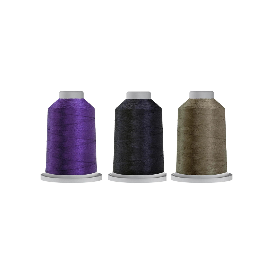 Dark Specialty Glide bundle featuring Raven, Blueberry, and German Granite quilting thread spools.