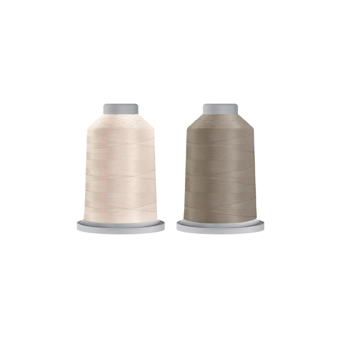 Cool Neutral Glide bundle featuring Cool Grey 3 and Bone quilting thread spools.